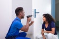 Technician Fixing The Door Lock Royalty Free Stock Photo