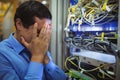 Technician getting stressed over server maintenance Royalty Free Stock Photo
