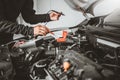 Technician Hands of car mechanic working in auto repair Service and Maintenance car battery Royalty Free Stock Photo