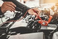 Technician Hands of car mechanic working in auto repair Service and Maintenance car battery Royalty Free Stock Photo