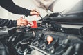 Technician Hands of car mechanic working in auto repair Service and Maintenance car battery Royalty Free Stock Photo
