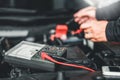 Technician Hands of car mechanic working in auto repair Service and Maintenance car battery Royalty Free Stock Photo