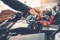 Technician Hands of car mechanic working in auto repair Service and Maintenance car battery Royalty Free Stock Photo