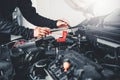 Technician Hands of car mechanic working in auto repair Service and Maintenance car battery Royalty Free Stock Photo