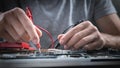 Technician hands checking motherboard with multimeter Royalty Free Stock Photo