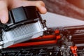 Technician hands installing CPU cooler fan on a computer pc motherboard with GPU rigs. Royalty Free Stock Photo