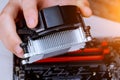 Technician hands installing CPU cooler fan on a computer pc motherboard Royalty Free Stock Photo