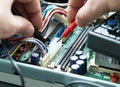 Technician hands with multimeter. Royalty Free Stock Photo