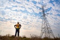 A technician at high voltage electricity poles. Working at height equipment. Fall arrestor device for worker with hooks for safety