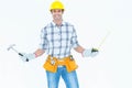 Technician holding hammer and measure tape Royalty Free Stock Photo