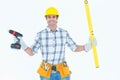 Technician holding portable drill and spirit level Royalty Free Stock Photo