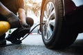 Technician is inflate car tire Royalty Free Stock Photo