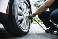 Technician is inflate car tire Royalty Free Stock Photo