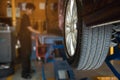 Technician is inflate car tire Royalty Free Stock Photo