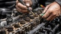 Technician inspecting and cleaning carbon buildup on a vehicles fuel injectors emphasizing handson maintenance and Royalty Free Stock Photo