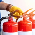 Technician Inspecting Fire Extinguishers for Safety (2 Royalty Free Stock Photo