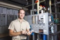 Technician inspecting heating system in boiler Royalty Free Stock Photo