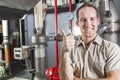 Technician inspecting heating system in boiler Royalty Free Stock Photo