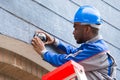 Technician Installing Camera On Wall Royalty Free Stock Photo