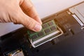 Technician installing RAM stick (random access memory) to socket Royalty Free Stock Photo