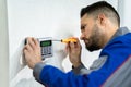 Technician Installing Security Access Alarm System Royalty Free Stock Photo