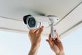 Security Camera Installation on Ceiling by Technician for Surveillance System Royalty Free Stock Photo