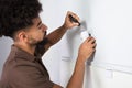 Technician Installing Security System Motion Sensor Royalty Free Stock Photo