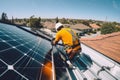 Technician installing solar panels on a rooftop under a bright blue sk