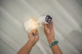 Technician installing wireless CCTV camera by screwed for home security system and installed w Royalty Free Stock Photo
