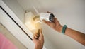 Technician installing wireless CCTV camera by screwed for home security system and installed w Royalty Free Stock Photo