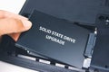 A technician installs a Solid State Drive SSD Royalty Free Stock Photo