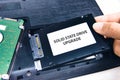 A technician installs a Solid State Drive SSD Royalty Free Stock Photo