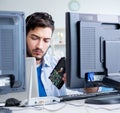 IT technician looking at IT equipment Royalty Free Stock Photo