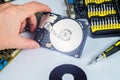 Technician makes a hard drive dissection Royalty Free Stock Photo