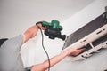 Technician man dry up and dust cleaning air Conditioner filter with electric blowers