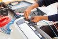 Technician man installing air conditioning in a client house, Electrician mounting the wires into air conditioning unit, Repairman Royalty Free Stock Photo