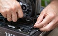 Technician man installing Fury Beast RAM DDR4 stick on professional computer. Russia, 17.08.2021