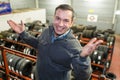 technician man promoting new tyres in car tire shop