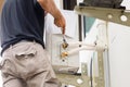 Technician man using a wrench to fix modern air conditioning system, Maintenance, repair and install new air conditioner Royalty Free Stock Photo