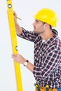 Technician marking while using spirit level Royalty Free Stock Photo