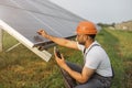 Technician measuring amperage of solar panels
