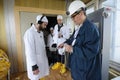 Technician measuring levels of radiation on journalists equipment after visiting Chernobyl Nuclear Power Plant building