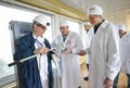 Technician measuring levels of radiation on journalists equipment after visiting Chernobyl Nuclear Power Plant building