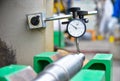 Technician measuring shaft runout by Dial Gauge Royalty Free Stock Photo