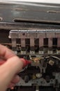 A technician measuring voltage at cassette tape reader head