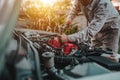 The technician mechanic checking engine.