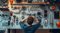 A technician in the midst of a complex home appliance repair, parts laid out systematically on a clean workspace Royalty Free Stock Photo