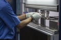 The technician operator working with hydraulic press brake bending machine Royalty Free Stock Photo