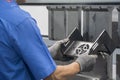 The technician operator working with hydraulic press brake bending machine. Royalty Free Stock Photo