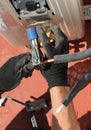 Technician placing a new compressor of air conditioner